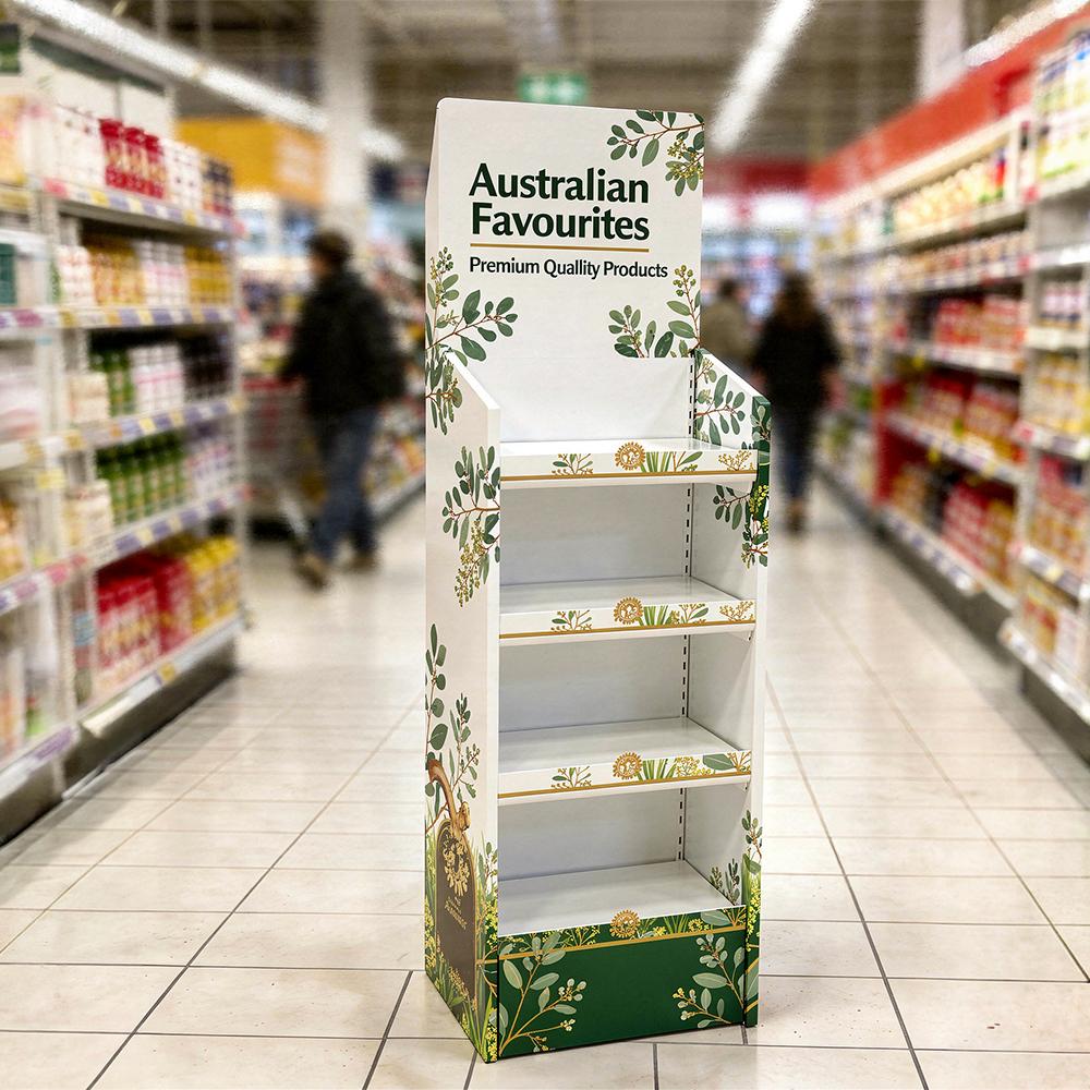 Printed cardboard floor display for FMCG promotions with multiple shelves and branded header for temporary retail campaigns.