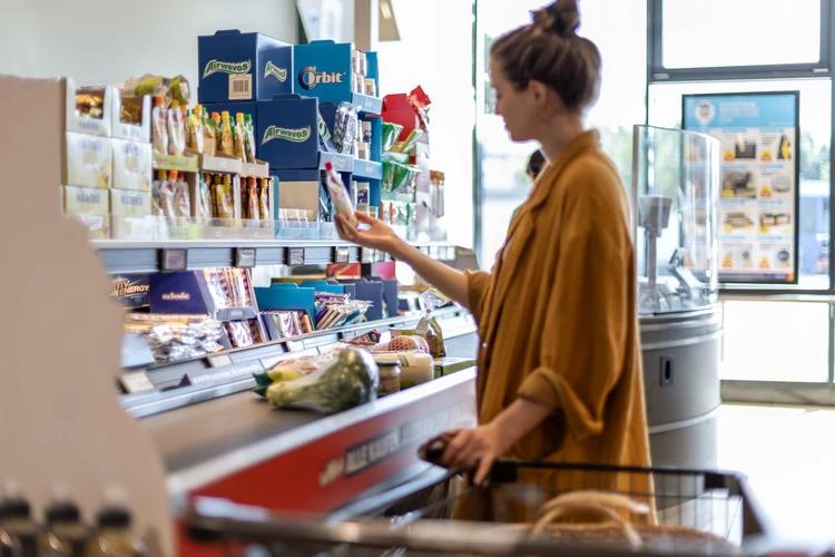 Retail checkout zone showing the customer waiting area where countertop displays and impulse purchase products naturally attract attention.