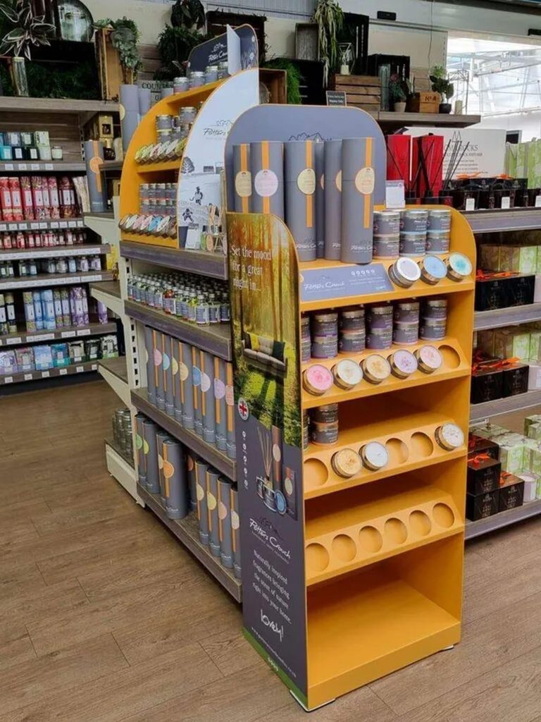 Seasonal freestanding retail display positioned in a high-traffic shopping aisle to promote featured products and encourage impulse purchases.